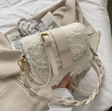 Moderna sieviešu dūnu soma ar garu ādas rokturi