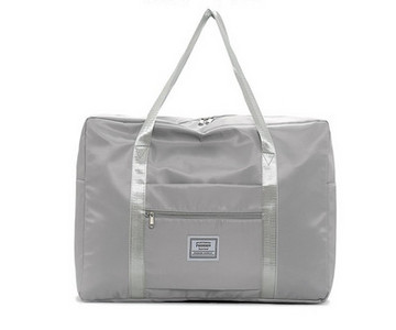 Kézipoggyásztáska külső zsebbel