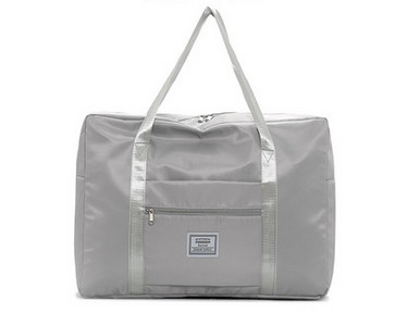 Kézipoggyásztáska külső zsebbel