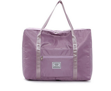 Kézipoggyásztáska külső zsebbel