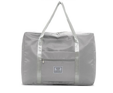 Kézipoggyásztáska külső zsebbel