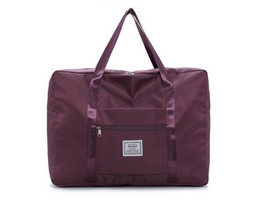 Kézipoggyásztáska külső zsebbel