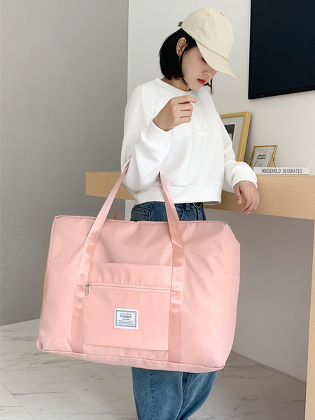 Kézipoggyásztáska külső zsebbel