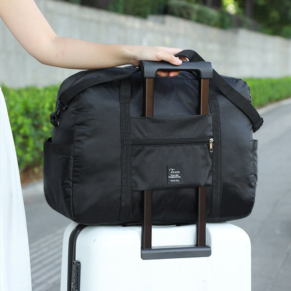 Taskuga reisikott mitmes värvitoonis