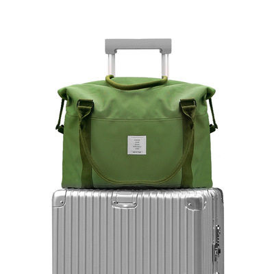 Hordozható utazótáska rövid pántokkal