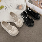 Ženske cipele s trakom i biserima