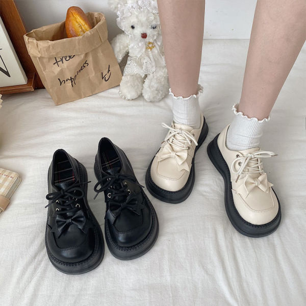 Ženske okrugle cipele s vezicama i trakom