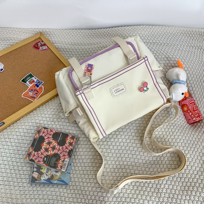 Bērnu tekstila soma ar uzrakstu un plastmasas aizdari