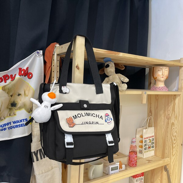 Igapäevane lastekott kirja ja aplikatsiooniga