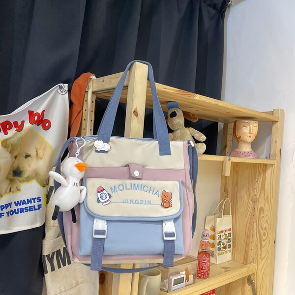 Igapäevane lastekott kirja ja aplikatsiooniga