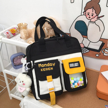 Υφασμάτινη παιδική τσάντα με τσέπες και μενταγιόν