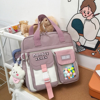 Текстилна детска чанта с джобове и висулка