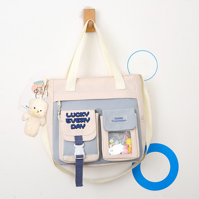 Textil gyerektáska zsebekkel és medállal