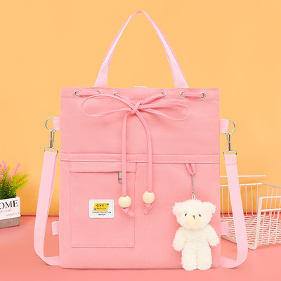 Textil gyerektáska zsebekkel és medállal