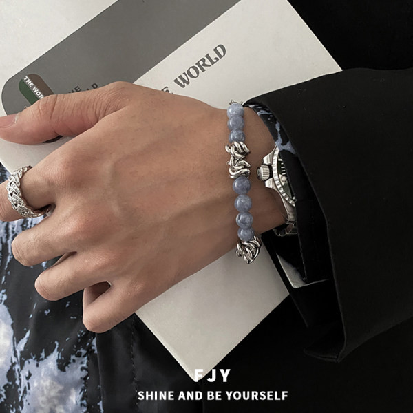 Moderna vīriešu rokassprādze ar krāsainiem akmeņiem