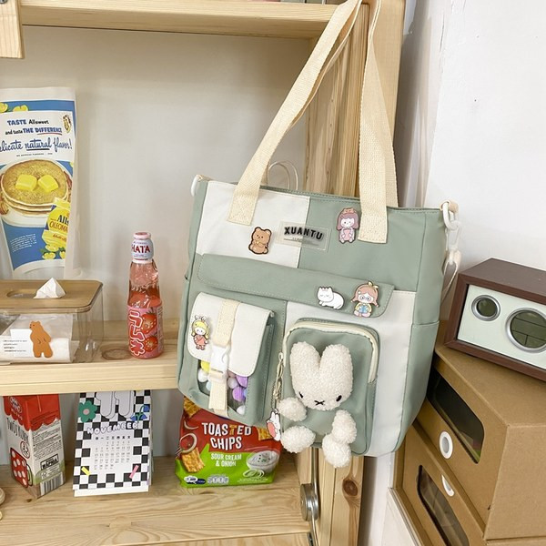 Bērnu tekstila mugursoma ar 3D elementiem un garu rokturi