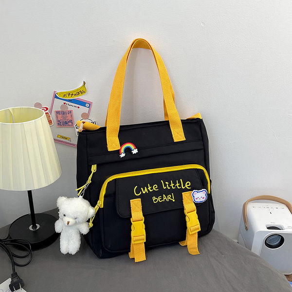 Tekstilna torba s izvezenim tekstom i privjeskom za dječake i djevojčice