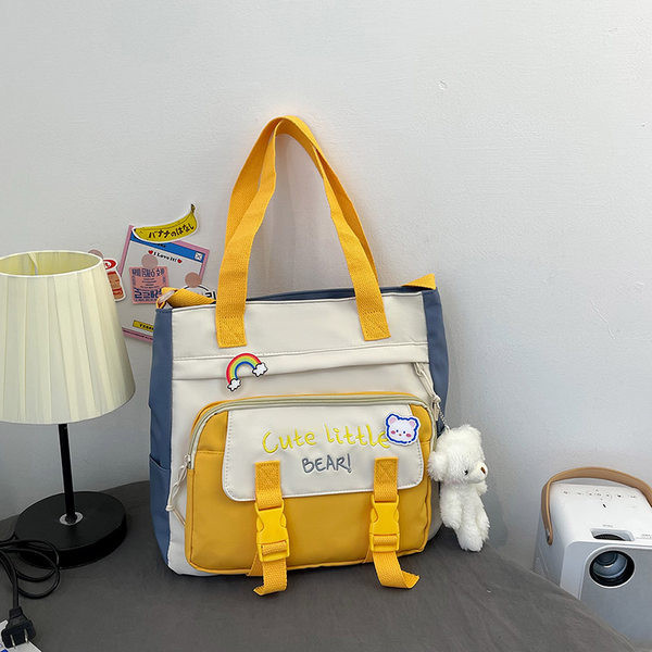 Tekstilna torba s izvezenim tekstom i privjeskom za dječake i djevojčice