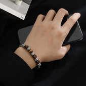 Férfi acél karkötő gyöngyökkel