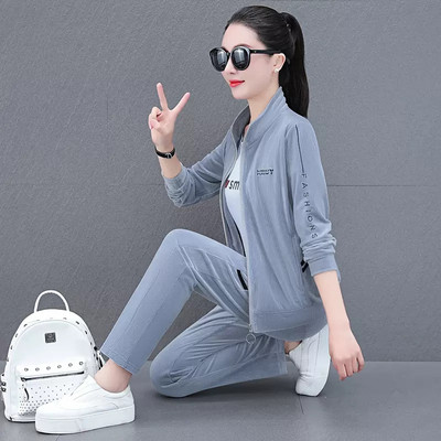 Sieviešu divdaļīgs komplekts ar apdruku un rāvējslēdzēja aizdari