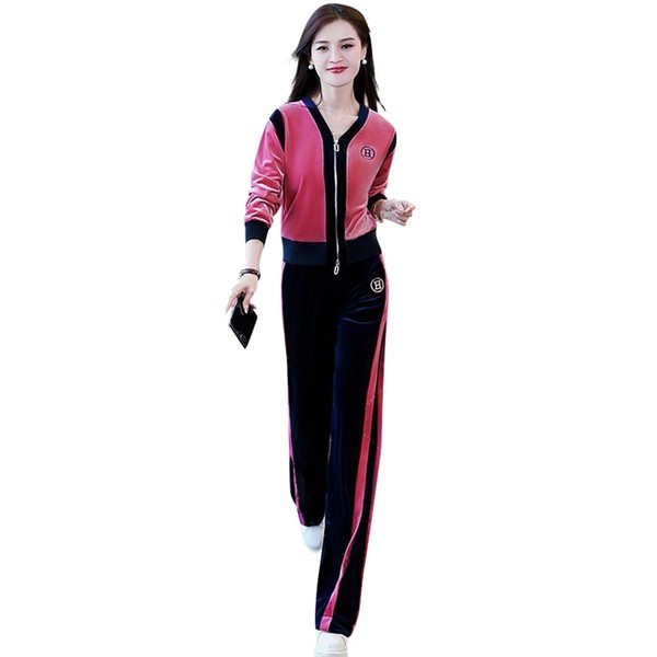 Sportski ženski dvodijelni komplet s dubokim izrezom i kopčanjem na patentni zatvarač