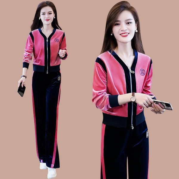 Sportski ženski dvodijelni komplet s dubokim izrezom i kopčanjem na patentni zatvarač