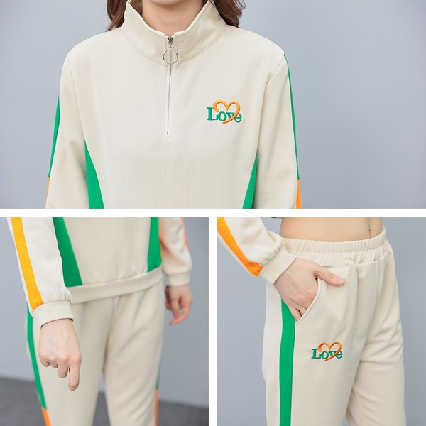 Sieviešu sporta divdaļīgs komplekts ar apdruku un rāvējslēdzēju