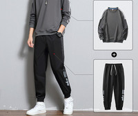 Ανδρικό αθλητικό σετ με οβάλ λαιμόκοψη και επιγραφή