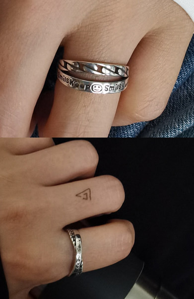 Vīriešu gredzens ar uzrakstu gadījuma modelis