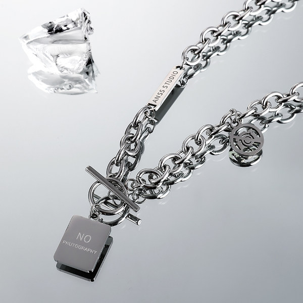 Vīriešu titāna tērauda ķēde ar divslāņu kulonu