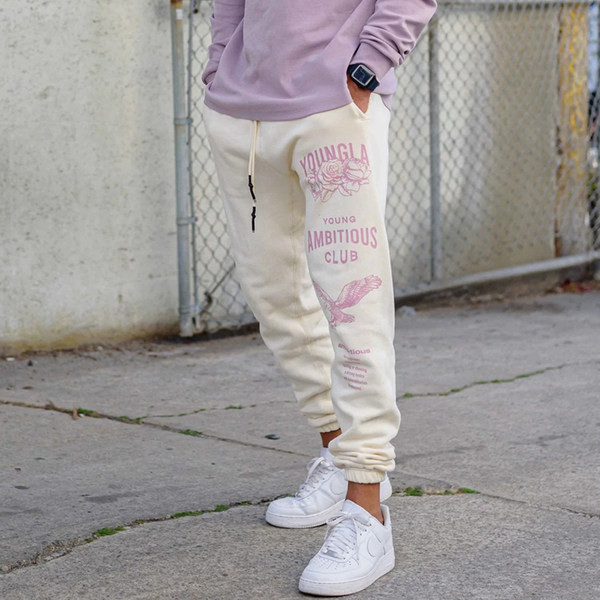 Vīriešu sporta bikses ar gumiju kājās un uzrakstu