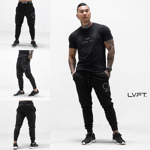 Sportiskas vīriešu bikses ar mežģīnēm un uzrakstu