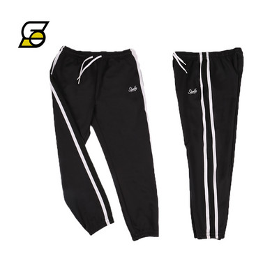 Alkalmi férfi nadrág csíkozással és felirattal