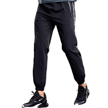 Ανδρικό αθλητικό παντελόνι σε γκρι και μαύρο χρώμα