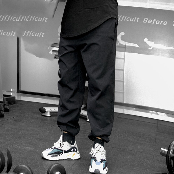 Vīriešu sporta bikses ar šņorēm un kabatu