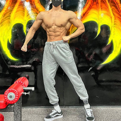 Elastīgas vīriešu bikses ar kabatu un saitēm