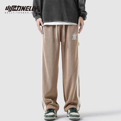 Férfi nadrág széles modell zsebbel és fűzővel