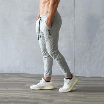 Мъжки спортен панталон с връзки и джоб слим модел