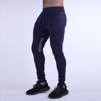 Спортен модел мъжки панталони с връзки и джоб с цип