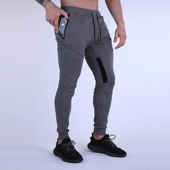 Спортен модел мъжки панталони с връзки и джоб с цип