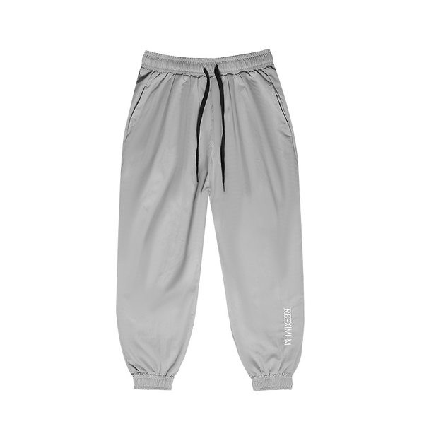 Vīriešu sporta bikses - plats modelis ar šņorēm un uzrakstu