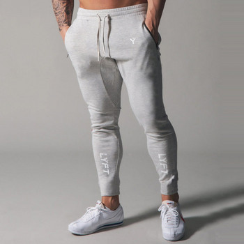 Спортни мъжки панталони с връзки и джоб с цип
