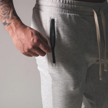Мъжки спортни панталони с връзки и джоб с цип