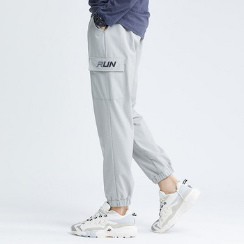 Мъжки спортен панталон с странични джобове и ластик
