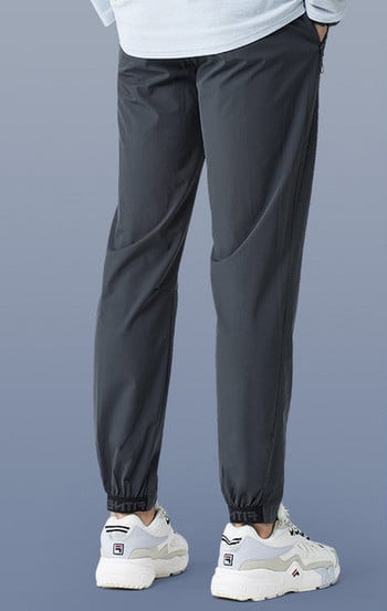 Спортен модел бързосъхнещ панталон с връзки и джоб