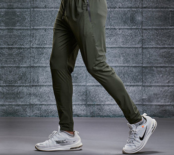 Спортен модел мъжки панталони с връзки и джоб с цип бързосъхнещи