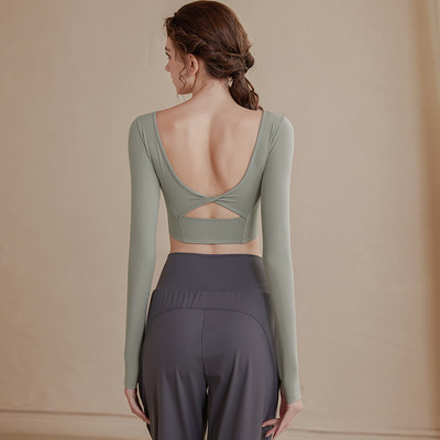 Vienkrāsaina sieviešu sporta blūze ar atkailinātu muguru