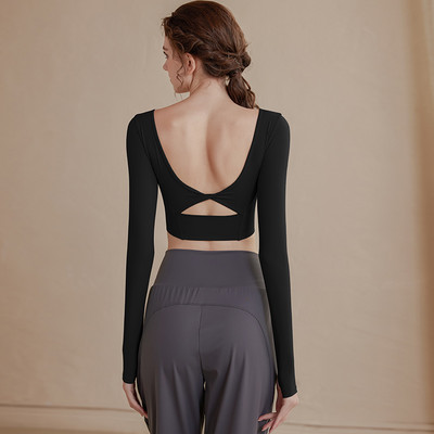 Vienkrāsaina sieviešu sporta blūze ar atkailinātu muguru