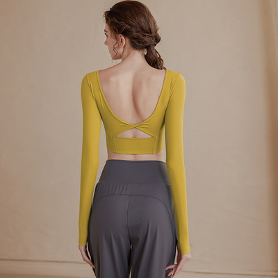 Vienkrāsaina sieviešu sporta blūze ar atkailinātu muguru