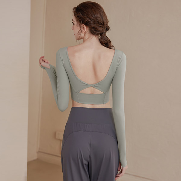 Vienkrāsaina sieviešu sporta blūze ar atkailinātu muguru